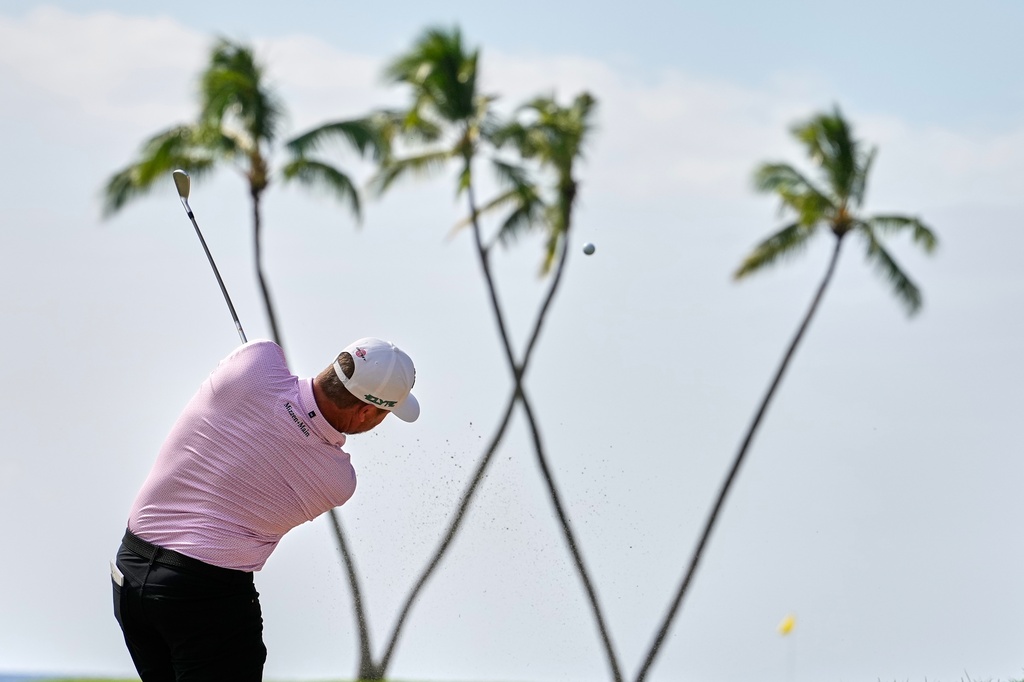 Brice Garnett hits on the 16th hole during the first round of the Sony Open golf event at the Waialae Country Club in Honolulu, Thursday, Jan. 15, 2026. (AP Photo/Matt York)