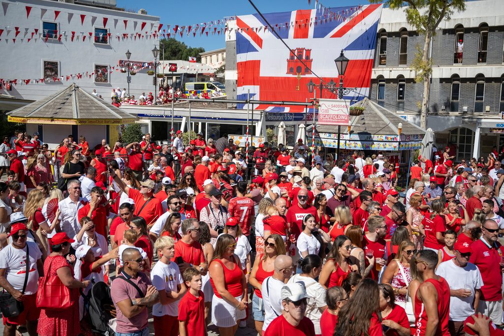 People gather during National Day celebrations in the contested territory of Gibraltar on Wednesday Sept. 10, 2025. (AP Photo/Marcos Moreno)