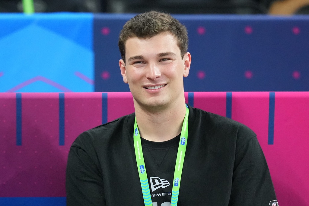 Indiana quarterback Fernando Mendoza (11) watches a drill at the NFL football scouting combine in Indianapolis, Saturday, Feb. 28, 2026. (AP Photo/Julio Cortez)