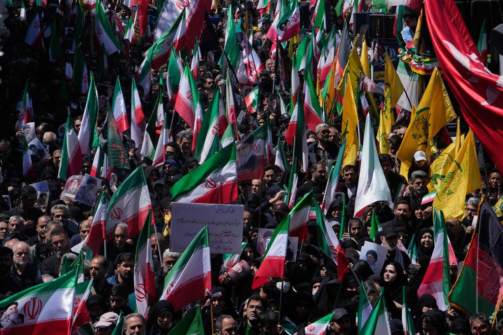 Government supporters gather to mark the 40th day since the death of Supreme Leader Ayatollah Ali Khamenei in Tehran, Iran, Thursday, April 9, 2026. (AP Photo/Vahid Salemi)