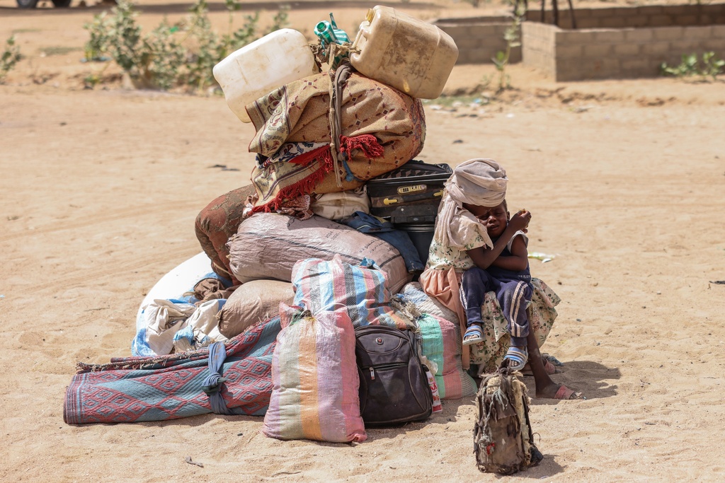 FILE - Refugees arrive at the border between Chad and Sudan before going to the Tine transit camp in Chad's Wadi Fara province Sunday, May 4, 2025. (AP Photo/Caitlin Kelly, file)