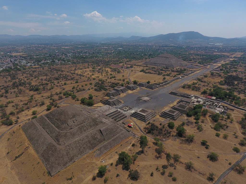 FILE - The Pyramid of the Moon, left, and the Pyramid of the Sun, back right, are seen along with smaller structures lining the Avenue of the Dead, in Teotihuacan, Mexico, March 19, 2020. (AP Photo/Rebecca Blackwell, File)