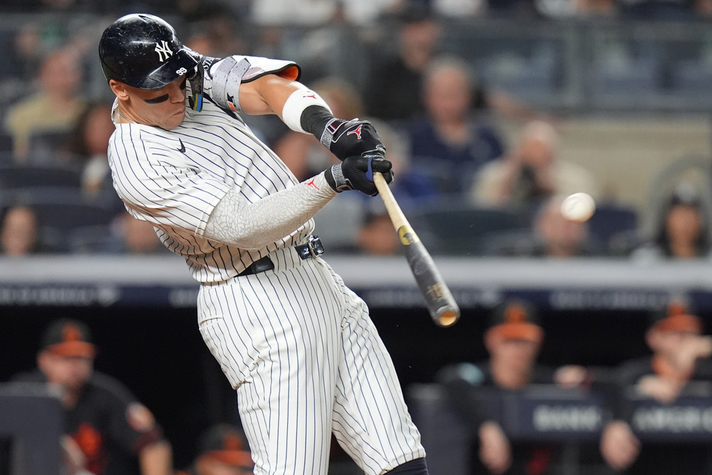 New York Yankees' Aaron Judge hits a two-run home run during the third inning of a baseball game against the Baltimore Orioles Friday, Sept. 26, 2025, in New York. (AP Photo/Frank Franklin II)