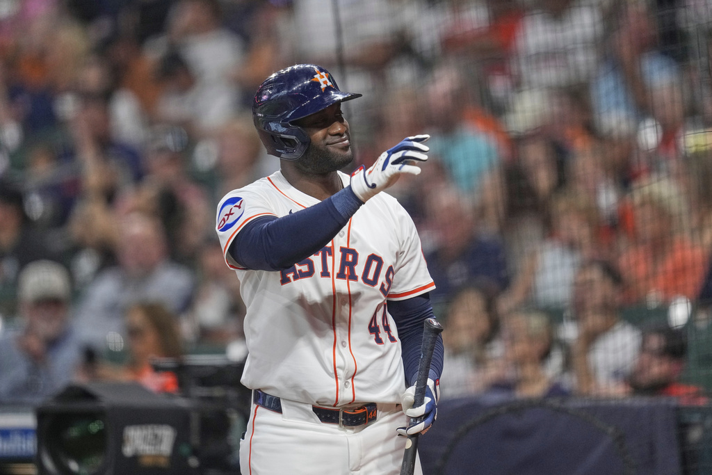 Houston Astros' Yordan Alvarez waves to fans as he comes up to bat against the Colorado Rockies during the first inning of a baseball game against the Colorado Rockies Tuesday, Aug. 26, 2025, in Houston. (AP Photo/David J. Phillip)