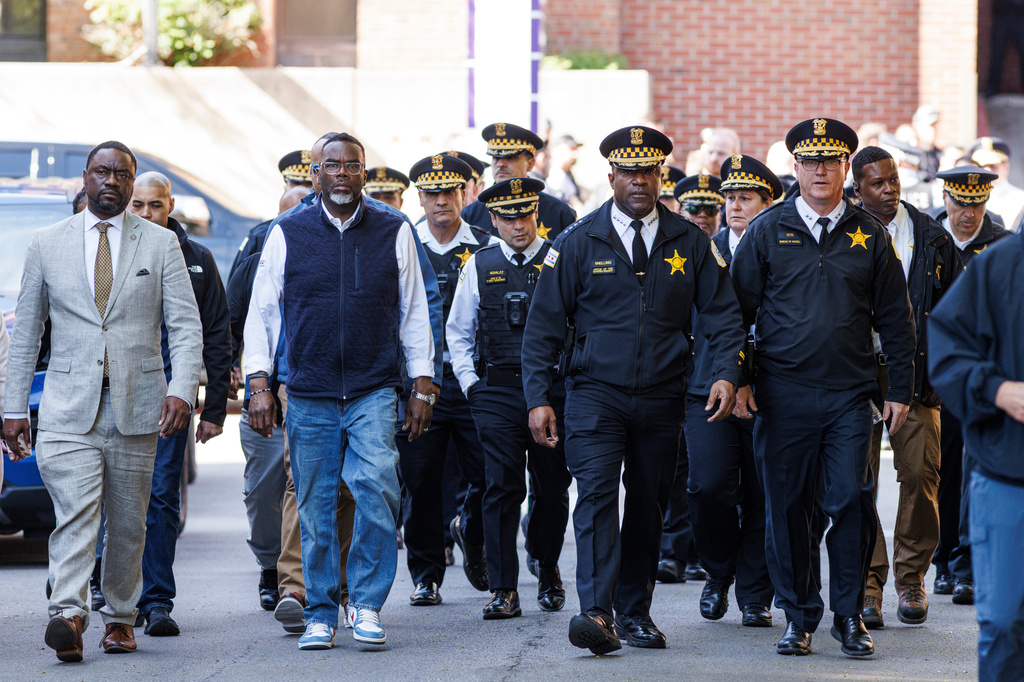 Mayor Brandon Johnson and Chicago Police Dept. Superintendent Larry Snelling are joined by other officials as they walk to address media outside of Illinois Masonic Hospital Advance Care in Lake View after a shooting Saturday, April 25, 2026, in Chicago. (Anthony Vazquez/Chicago Sun-Times via AP)