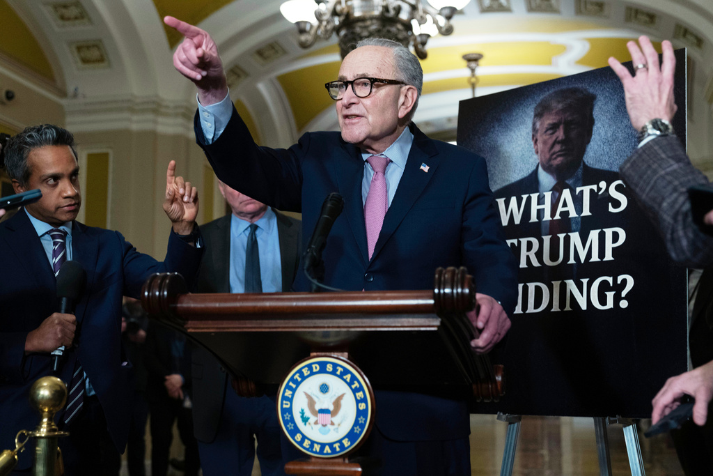Senate Minority Leader Chuck Schumer, D-N.Y., speaks to reporters following the weekly policy luncheons at the Capitol, Tuesday, Dec. 16, 2025, in Washington. (AP Photo/Jose Luis Magana)