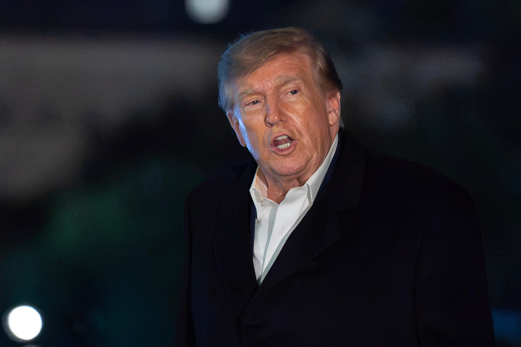 President Donald Trump talks to reporters as he walks on the South Lawn upon his arrival to the White House, Tuesday, Oct. 20, 2026, in Washington. (AP Photo/Jose Luis Magana)