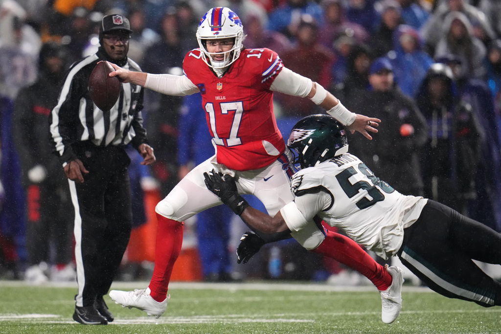 Buffalo Bills' Josh Allen (17) is sacked by Philadelphia Eagles' Jalyx Hunt (58) during the second half of an NFL football game, Sunday, Dec. 28, 2025, in Buffalo, N.Y. (AP Photo/Gene J. Puskar)