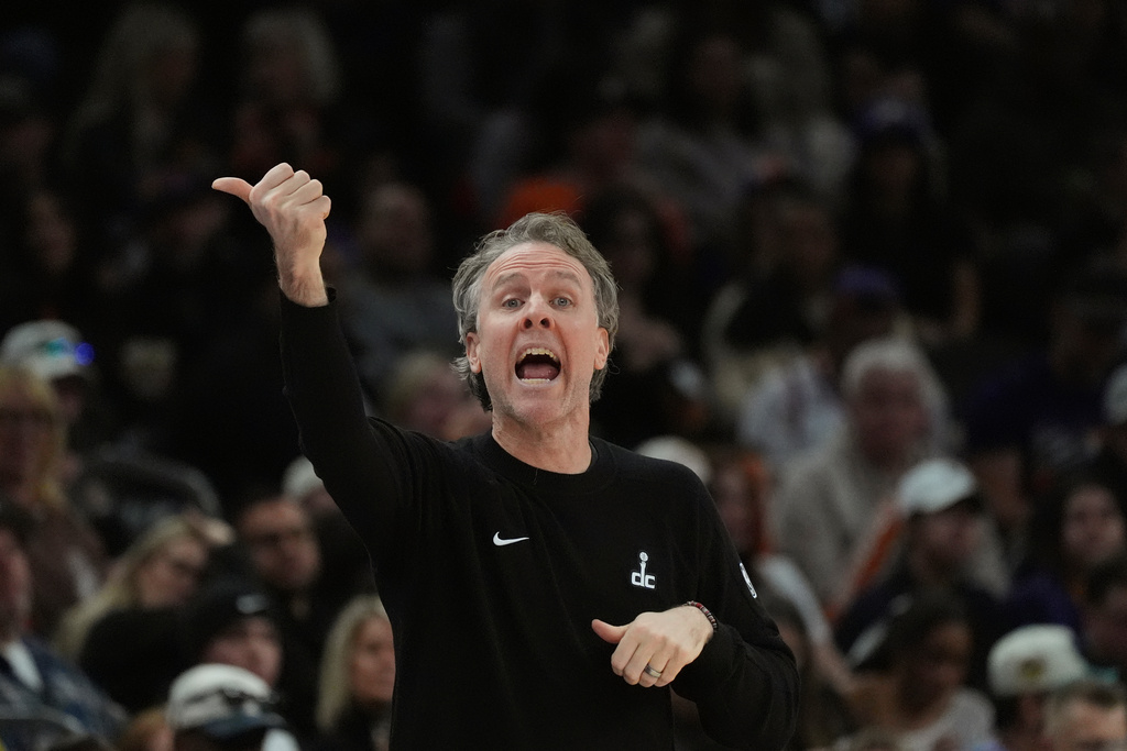 Washington Wizards head coach Brian Keefe shouts instructions to his players during the first half of an NBA basketball game against the Phoenix Suns, Sunday, Jan. 11, 2026, in Phoenix. (AP Photo/Ross D. Franklin)