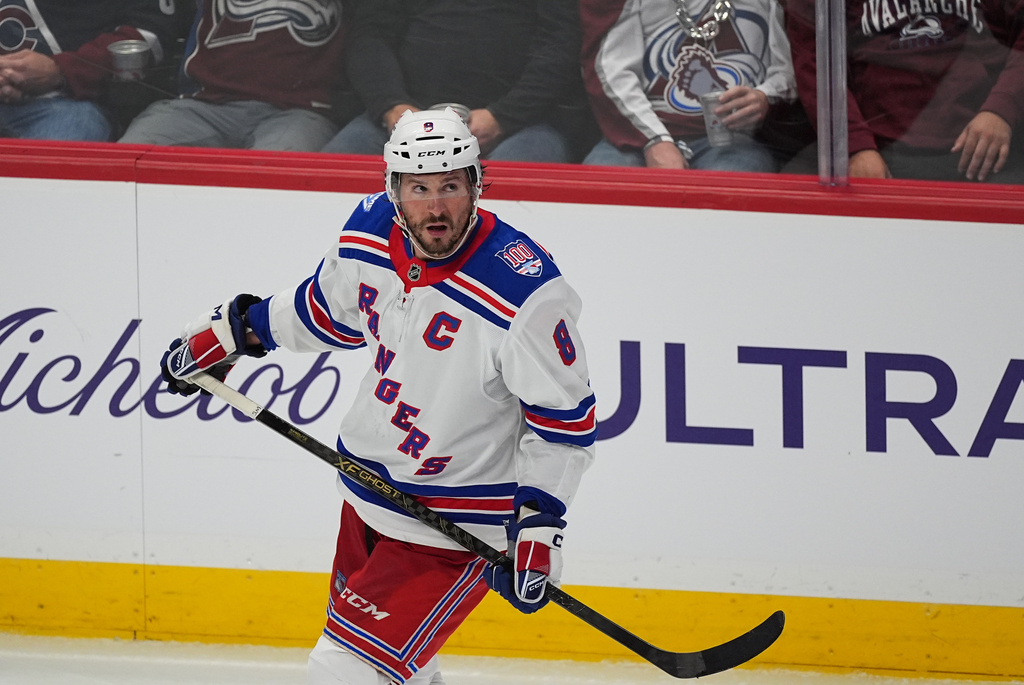 New York Rangers center J.T. Miller (8) in the third period of an NHL hockey game Thursday, Nov. 20, 2025, in Denver. (AP Photo/David Zalubowski)