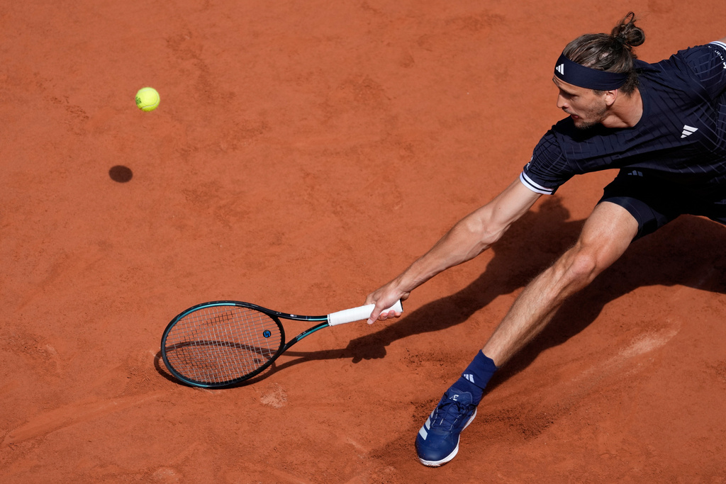 Alexander Zverev of Germany returns to Flavio Cobolli of Italy during their men's final match at the French Open tennis tournament in Paris, Sunday, June 7, 2026. (AP Photo/Christophe Ena)