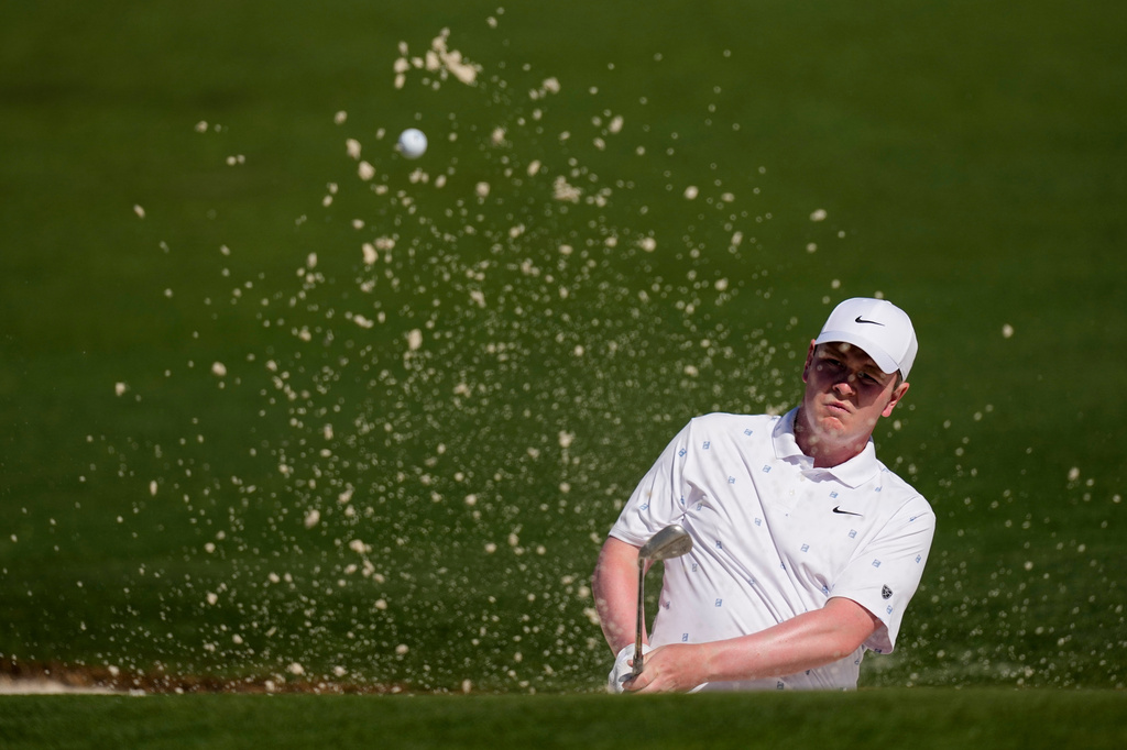 Robert MacIntyre, of Scotland, hits from the bunker on the second hole during the second round of the Masters golf tournament at the Augusta National Golf Club, Friday, April 10, 2026, in Augusta, Ga. (AP Photo/David J. Phillip)