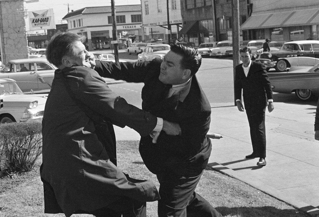 FILE - Alton Wayne Roberts punches CBS cameraman Laurens Pierce outside the Federal Building in Meridian, Miss., Jan. 27, 1965. Roberts, a 26-year-old salesman, was a defendant in the deaths of three civil rights workers. (AP Photo/Jack Thornell, File)