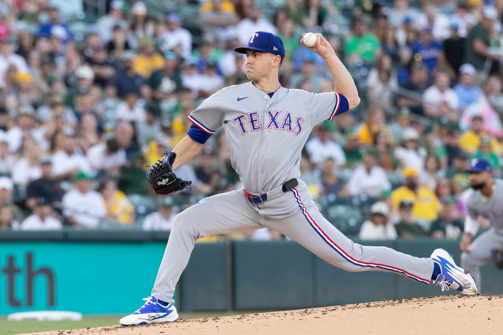 Texas Rangers pitcher MacKenzie Gore throws to the Athletics during the first inning of a baseball game Saturday, Aug. 15, 2026, in West Sacramento, Calif. (AP Photo/Sara Nevis)