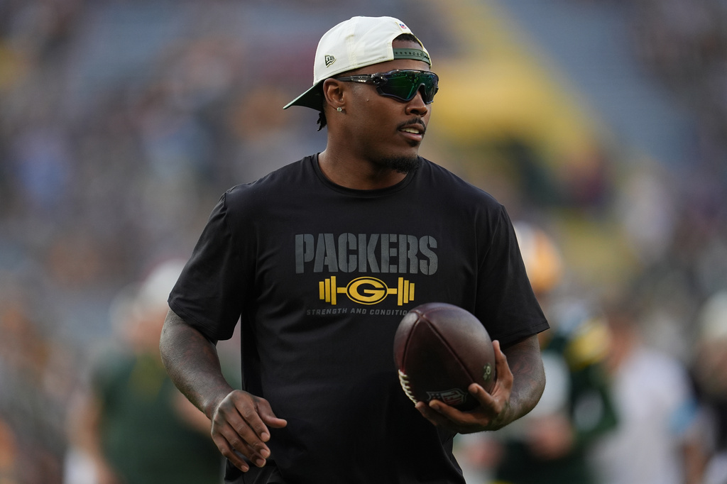FILE - Green Bay Packers running back Josh Jacobs stands on the field before a preseason NFL football game against the Arizona Cardinals, Aug. 28, 2026, in Green Bay, Wis. (AP Photo/Abbie Parr, File)