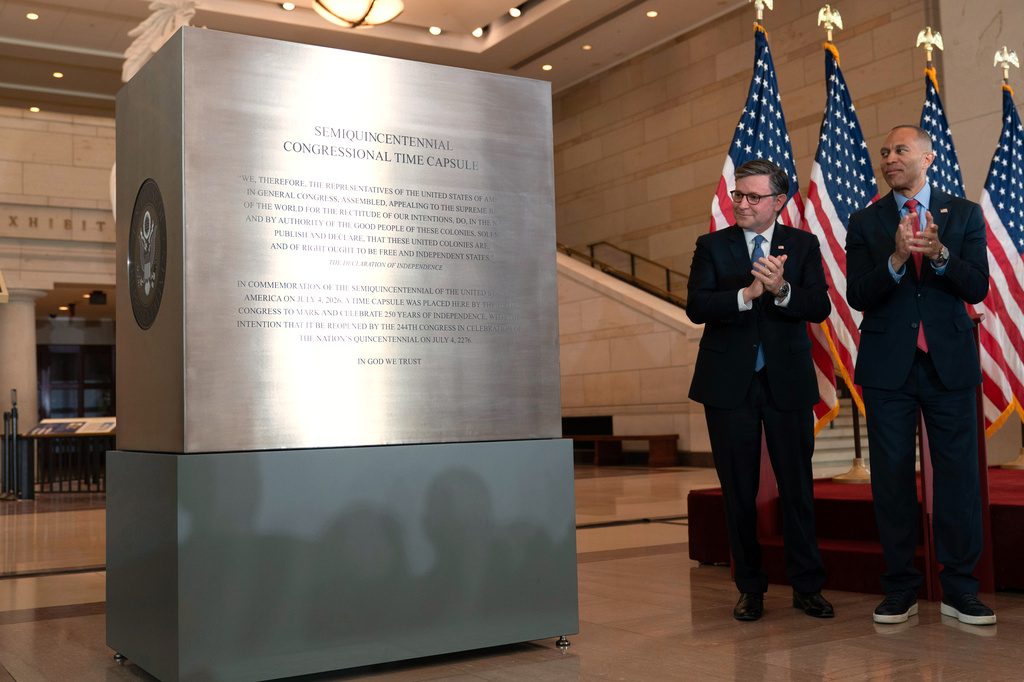 Speaker of the House Mike Johnson, R-La., left, and House Minority Leader Hakeem Jeffries, D-N.Y., unveil the Congressional Time Capsule at the Capitol, Wednesday, June 24, 2026, in Washington. (AP Photo/Jose Luis Magana)