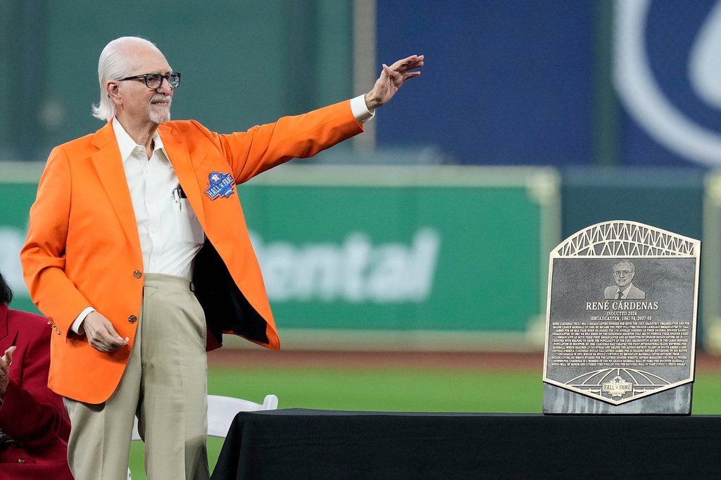 FILE - Longtime Spanish radio broadcaster René Cárdenas waves to the crowd as he is inducted into the Houston Astros Hall of Fame Saturday, Aug. 17, 2024, in Houston. (AP Photo/Kevin M. Cox, File)