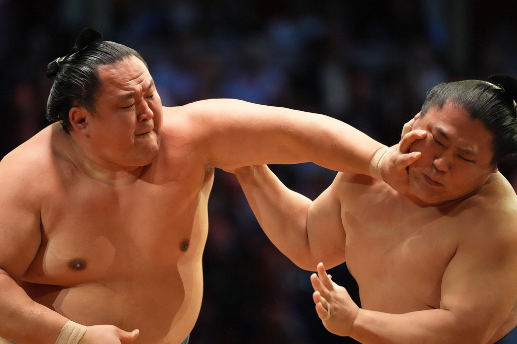 Tamawashi, left, pushes Watakakage during a bout at The Grand Sumo Tournament at the Royal Albert Hall in London, Wednesday, Oct. 15, 2025.(AP Photo/Frank Augstein)