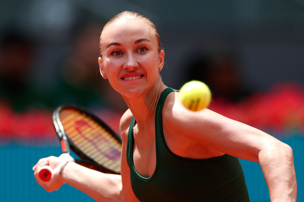 Anastasia Potapova of Russia returns the ball to Karolina Pliskova of the Czech Republic during the Madrid Open tennis tournament in Madrid, Wednesday, April 29, 2026. (AP Photo/Pablo Garcia)