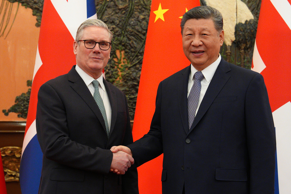 British Prime Minister Keir Starmer, left, shakes hands with Chinese President Xi Jinping ahead of a meeting in Beijing Thursday, Jan. 29, 2026. (Carl Court/Pool Photo via AP)