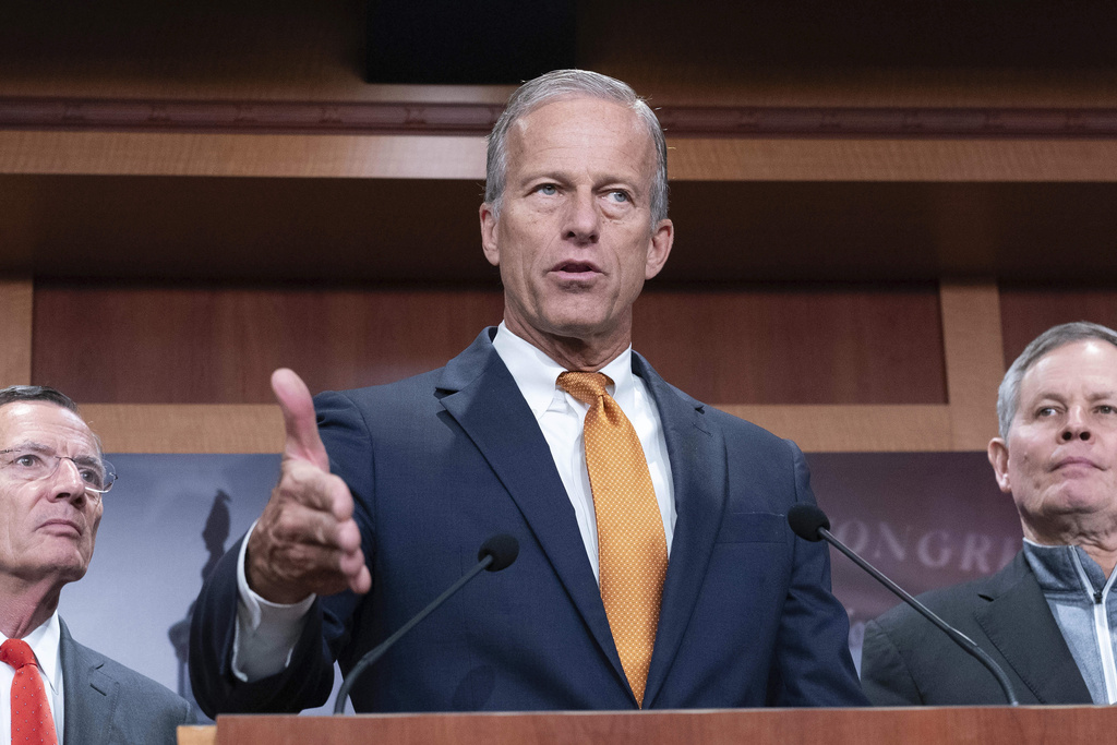 Senate Majority Leader John Thune, R-S.D., flanked by Sen. John Barrasso, R-Wyo., left, and Sen. Steve Daines, R-Mont., speaks during a news conference on Capitol Hill in Washington, Friday, Sept. 19, 2025. (AP Photo/Jose Luis Magana)