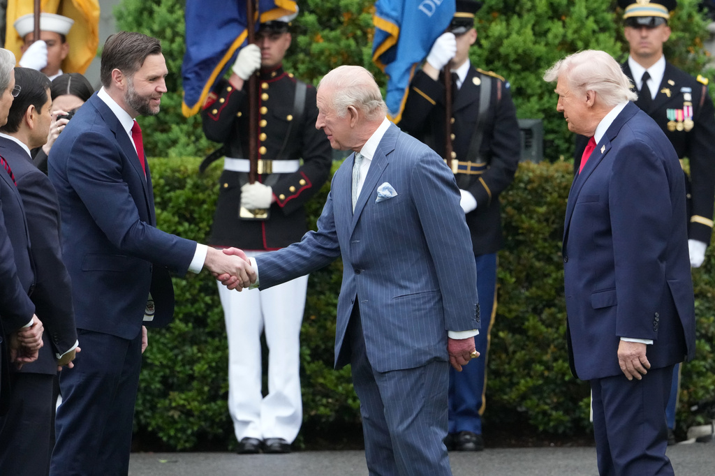 President Donald Trump watches as Britain's King Charles III greets Vice President JD Vance during a State Visit arrival ceremony on the South Lawn of the White House, Tuesday, April 28, 2026, in Washington. (AP Photo/Alex Brandon)