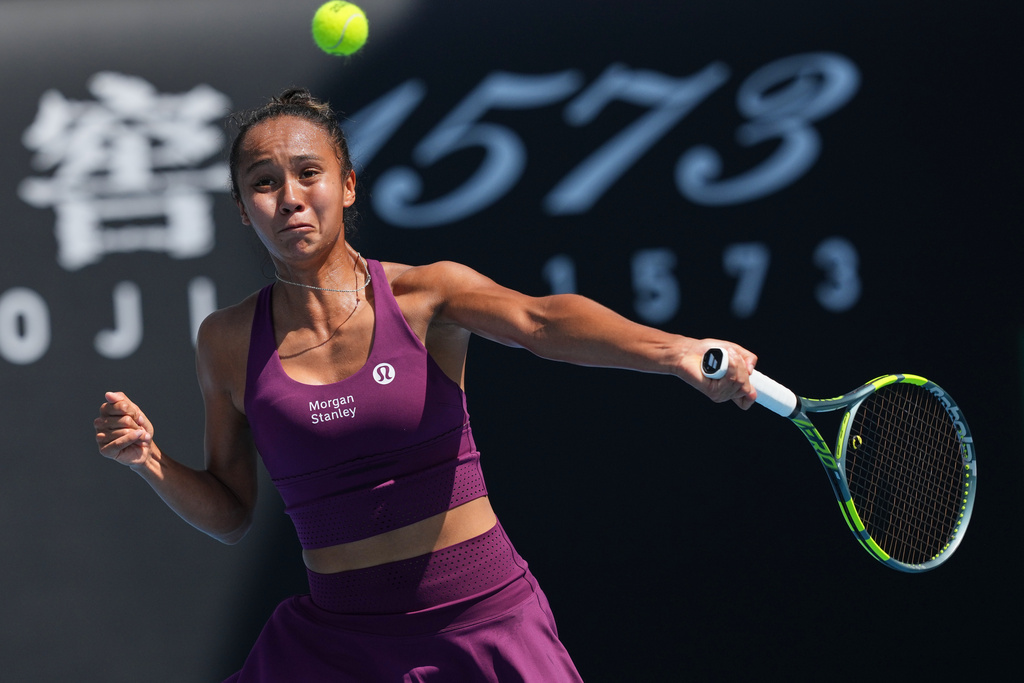 Leylah Fernandez of Canada plays a forehand return to Janice Tjen of Indonesia during their first round match at the Australian Open tennis championship in Melbourne, Australia, Tuesday, Jan. 20, 2026. (AP Photo/Dar Yasin)