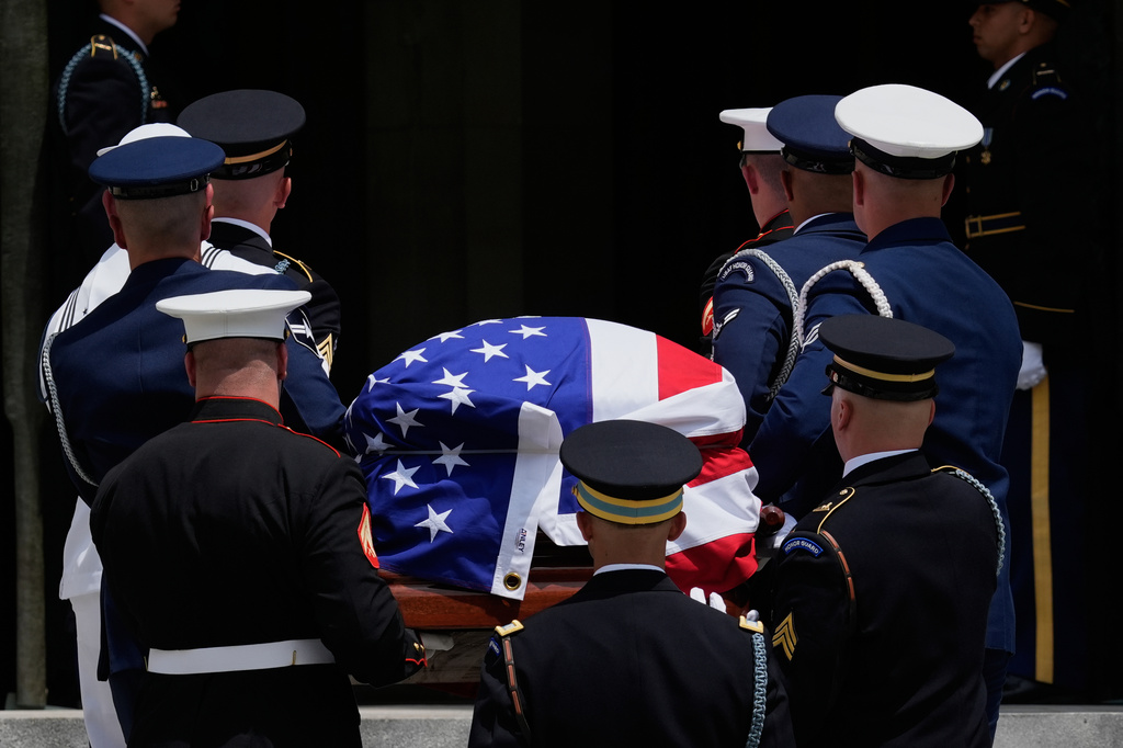 An Armed Forces Body Bearer Team carries the flag-draped casket of Sen. Lindsey Graham, R-S.C., into the Washington National Cathedral, Tuesday, July 28, 2026, in Washington. (AP Photo/Manuel Balce Ceneta)