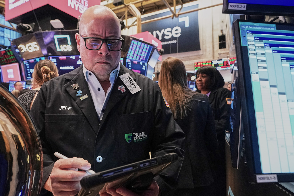 Trader Jeffrey Vazquez works on the floor of the New York Stock Exchange, Thursday, Feb. 5, 2026. (AP Photo/Richard Drew)