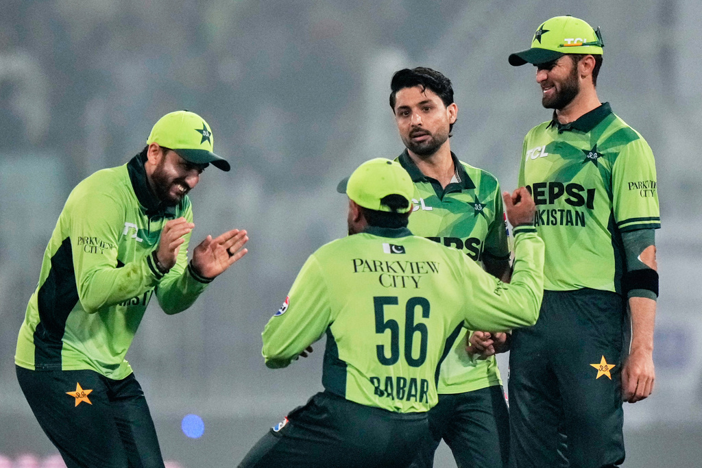 Pakistan's Abrar Ahmed, second right, celebrates with teammates after the dismissal of South Africa's Donovan Ferreira during the first one day international cricket match between Pakistan and South Africa, in Faisalabad, Pakistan, Tuesday, Nov. 4, 2025. (AP Photo/Anjum Naveed)