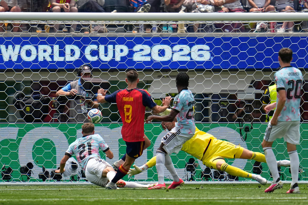 Spain's Fabian Ruiz (8) scores their opening goal during the World Cup quarterfinal soccer match between Spain and Belgium in Inglewood, Calif., near Los Angeles, Friday, July 10, 2026. (AP Photo/Gregory Bull)