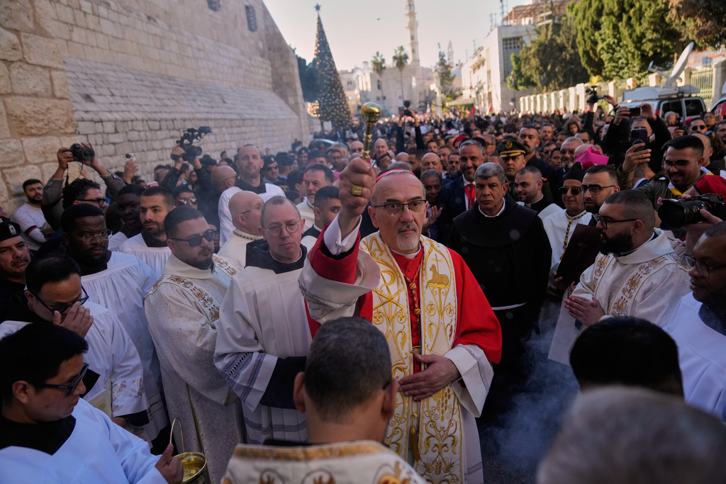 Latin Patriarch Pierbattista Pizzaballa, the top Catholic clergyman in the Holy Land, arrives at the Church of the Nativity, traditionally believed to be the birthplace of Jesus, on Christmas Eve, in the West Bank city of Bethlehem, Wednesday, Dec. 24, 2025. (AP Photo/Nasser Nasser)