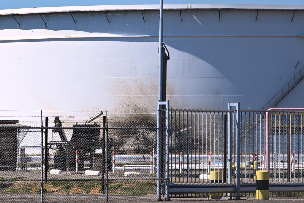 A structure in a refinery and fuel terminal run by Gunvor Energy carries the traces of an explosion at the Dutch port of Rotterdam which killed at least one person and injured several others according to police, in Rotterdam, Netherlands, Thursday, Aug. 13, 2026. (AP Photo/Mouneb Taim)