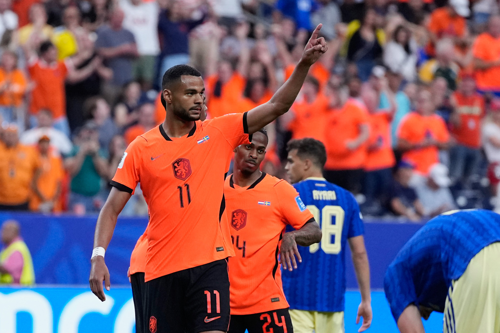 Netherlands' Cody Gakpo (11) celebrates after scoring his side's fourth goal during the World Cup Group F soccer match between the Netherlands and Sweden in Houston, Saturday, June 20, 2026. (AP Photo/Ashley Landis)