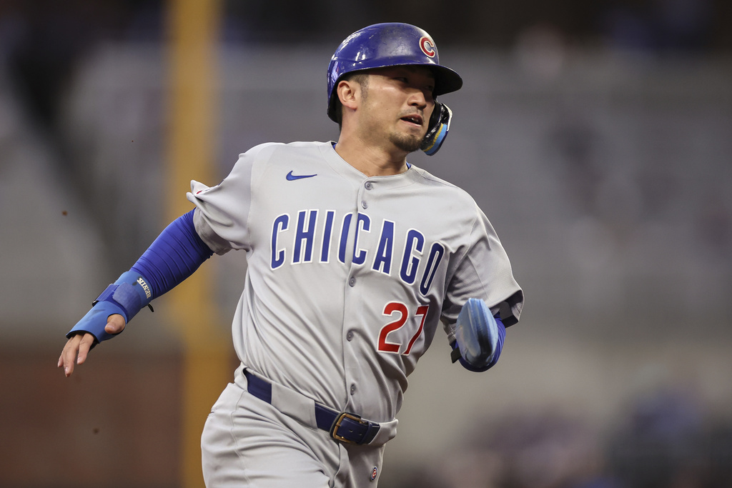 Chicago Cubs' Seiya Suzuki (27) runs to third base in the third inning of a baseball game against the Atlanta Braves, Tuesday, Sept. 9, 2025, in Atlanta. (AP Photo/Colin Hubbard)