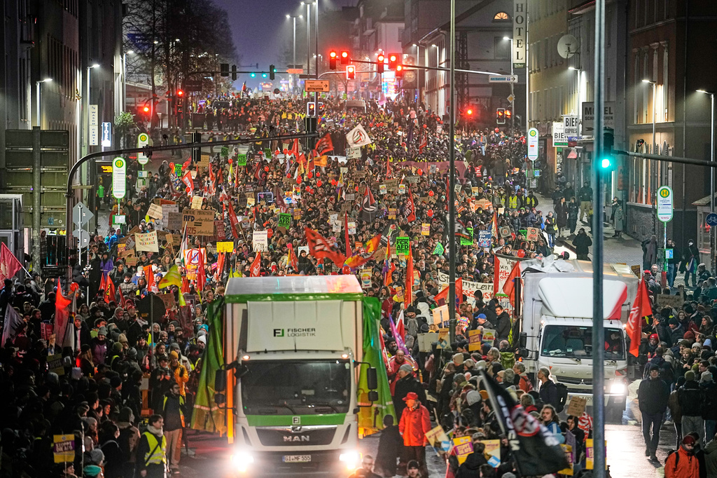 FILE - People demonstrate against the planned re-founding of the AfD youth organization in Giessen, Nov. 29, 2025. (AP Photo/Martin Meissner, File)