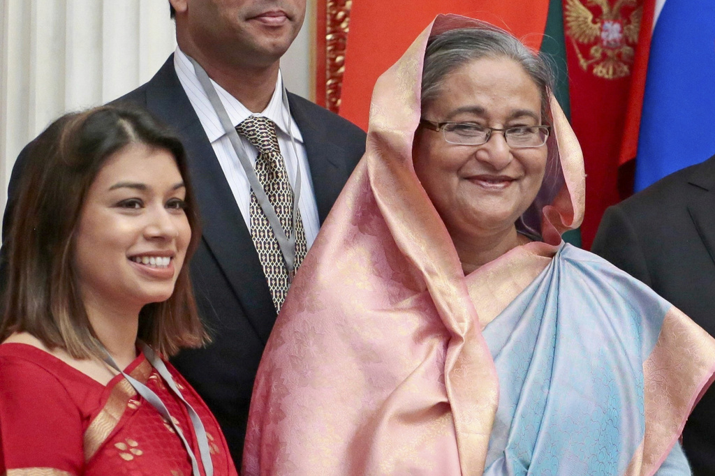FILE - Tulip Siddiq, left, stands beside Bangladesh Prime Minister Sheikh Hasina in the Kremlin in Moscow, Russia, Jan. 15, 2013. (AP Photo/Mikhail Metzel, Pool, File)