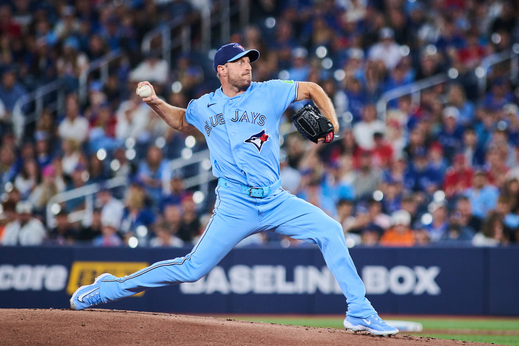 Toronto Blue Jays' Max Scherzer works against the St. Louis Cardinals during the first inning of a baseball game in Toronto, Sunday, Aug. 2, 2026. (Sammy Kogan/The Canadian Press via AP)