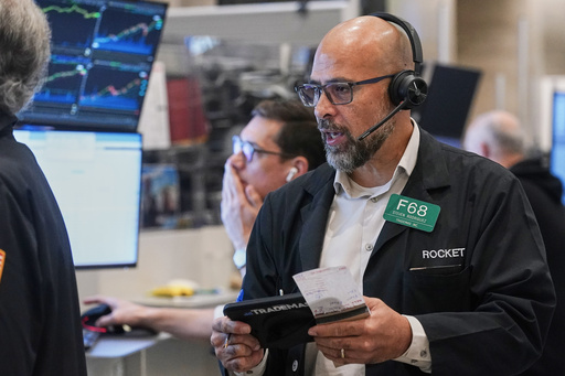 Options trader Steven Rodriguez works on the floor of the New York Stock Exchange, Monday, Oct. 13, 2025. (AP Photo/Richard Drew) Options trader Steven Rodriguez works on the floor of the New York Stock Exchange, Monday, Oct. 13, 2025. (AP Photo/Richard Drew)