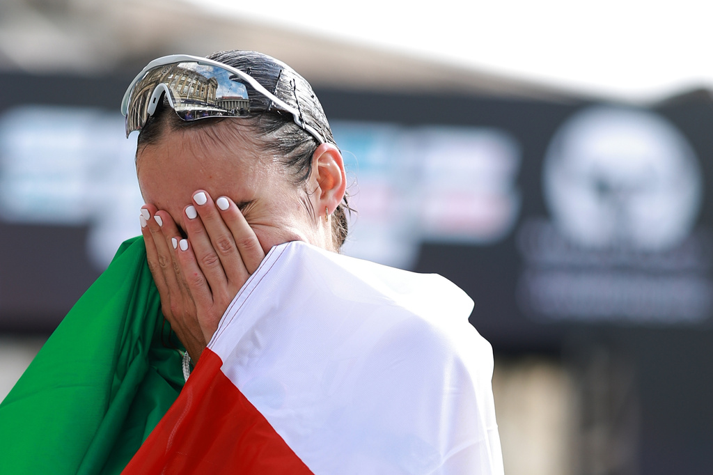 Italy's Sofia Fiorini reacts after winning the women's marathon walk at the European Athletics Championships in Birmingham, England, Saturday, Aug. 15, 2026. (AP Photo/Morgan Harlow)