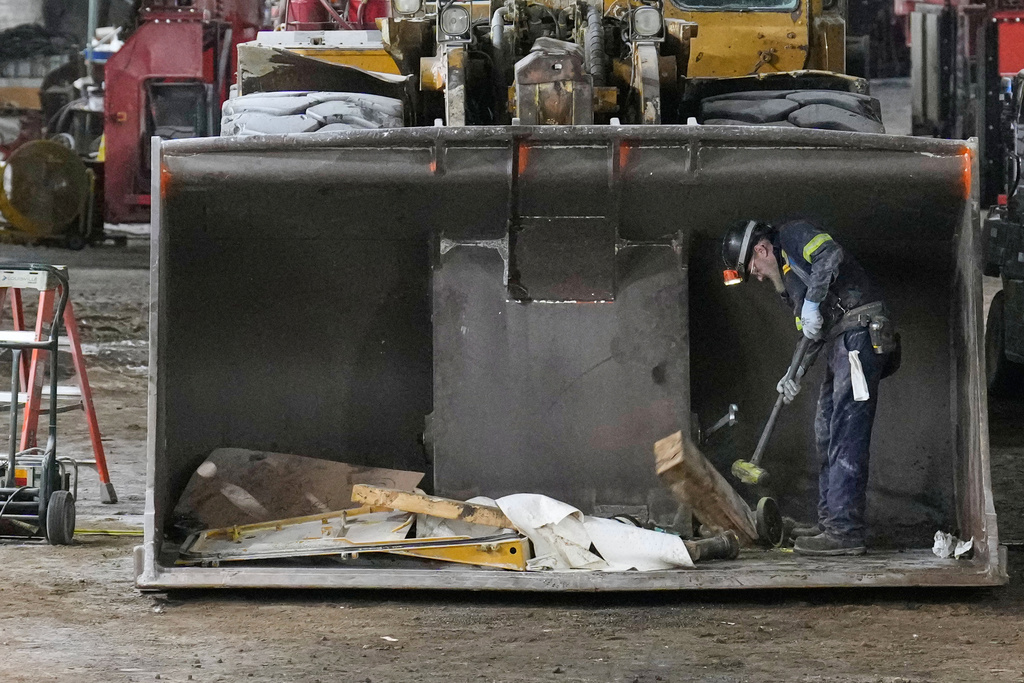 A worker repairs machinery used to muck the salt, in the shop at the Cargill salt mine on Whiskey Island in Cleveland, Ohio, Thursday, March 19, 2026. (AP Photo/Sue Ogrocki)