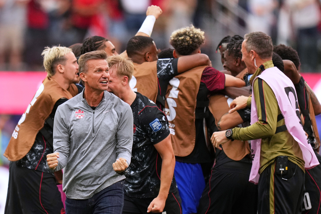 Canada head coach Jesse Marsch celebrates after Stephen Eustaquio scored their opening goal against South Africa during the World Cup round of 32 soccer match in Inglewood, Calif., near Los Angeles, Sunday, June 28, 2026. (AP Photo/Andre Penner)