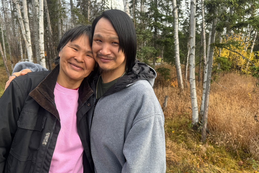 CORRECTS NAME TO ALEXIE, NOT ALEXEI - Julia Stone, left, and her son Alexie pose for a photo Thursday, Oct. 16, 2025, in Anchorage, Alaska, after evacuating the storm-ravaged village of Kipnuk, Alaska. (AP Photo/Mark Thiessen)