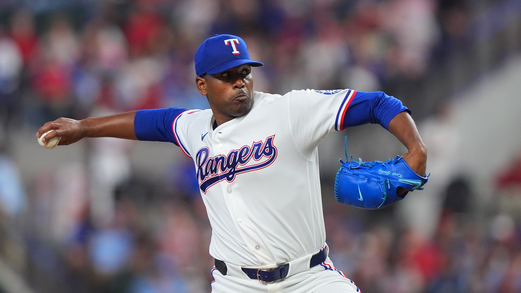 Texas Rangers starting pitcher Kumar Rocker throws during the first inning of a baseball game against the Cincinnati Reds, Saturday, April 4, 2026, in Arlington, Texas. (AP Photo/LM Otero)