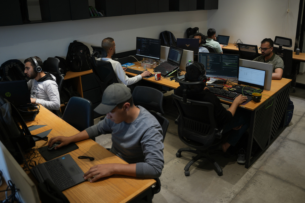 Palestinian digital freelancers work on projects for clients abroad at a coworking space in Gaza City, Tuesday, May 12, 2026. (AP Photo/Abdel Kareem Hana)