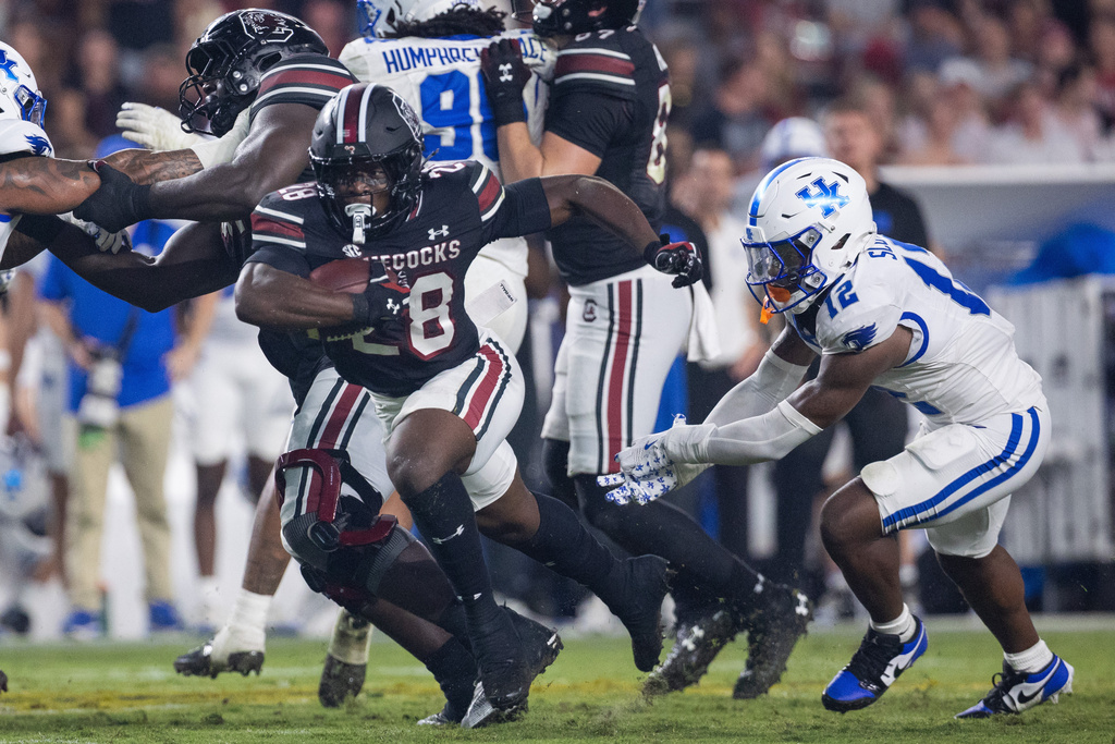 South Carolina running back Matt Fuller (28) runs the ball against the Kentucky during the second half of an NCAA college football game, Saturday, Sept. 27, 2025, in Columbia, S.C. (AP Photo/Scott Kinser)