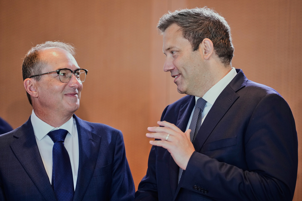 German Finance Minister and Vice Chancellor Lars Klingbeil, right, and Interior Minister Alexander Dobrindt arrive for the cabinet meeting at the chancellery in Berlin, Germany, Wednesday, Aug. 12, 2026. (AP Photo/Ebrahim Noroozi)