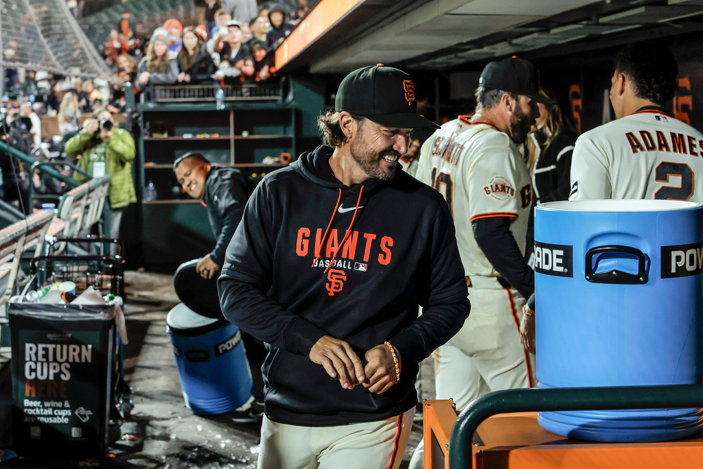 San Francisco Giants manager Tony Vitello smiles in the dugout after the San Francisco Giants defeated the New York Mets 7-2 for his first win at home as the manager at Oracle Park in San Francisco, on Thursday, April 2, 2026. (Carlos Avila Gonzalez/San Francisco Chronicle via AP)