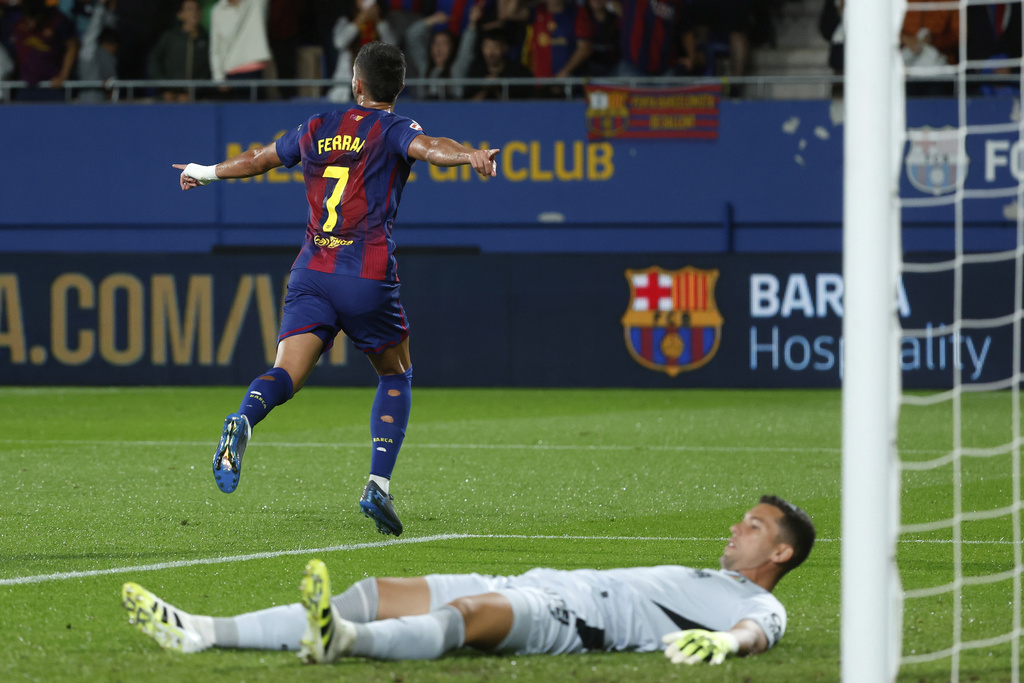 Barcelona's Ferran Torres celebrates the opening goal during a Spanish La Liga soccer match between FC Barcelona and Getafe at the Johan Cruyff stadium in Barcelona, Spain, Sunday, Sept. 21, 2025. (AP Photo/Joan Monfort)