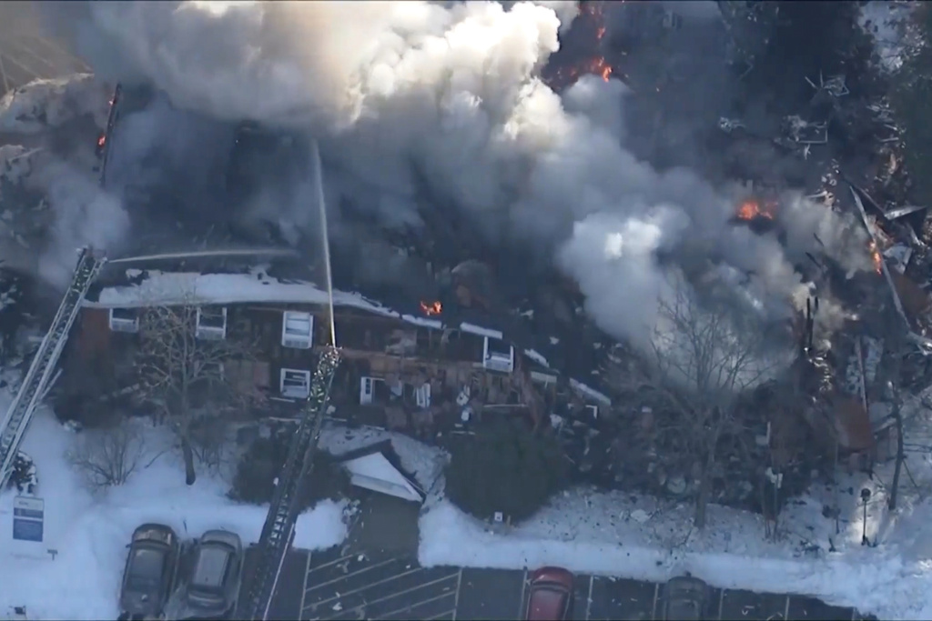 This image made from video provided by WCVB-TV shows an ongoing fire following a natural gas explosion inside a building in Nashua, N.H., Monday Feb. 2, 2026. (WCVB-TV via AP)